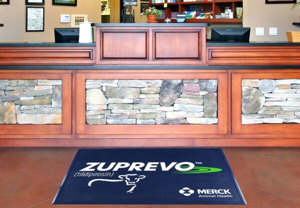 Molded Vinyl Floor Mat in Use - Illustration of the molded vinyl floor mat with vibrant colors and custom designs, suitable for entrances or retail check-out areas, leaving a lasting impression